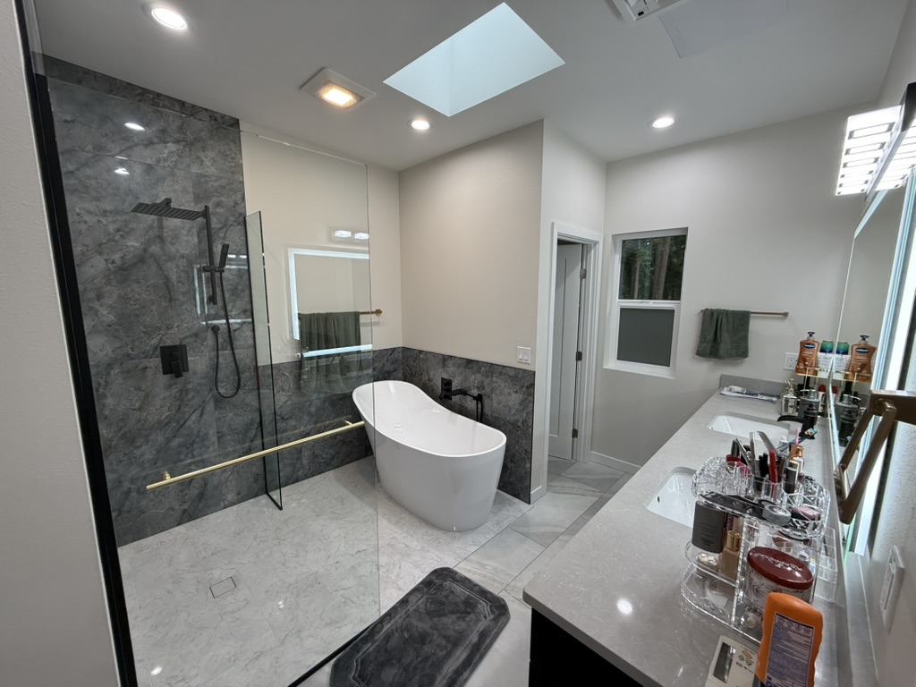 Freestanding tub and glass shower enclosure
