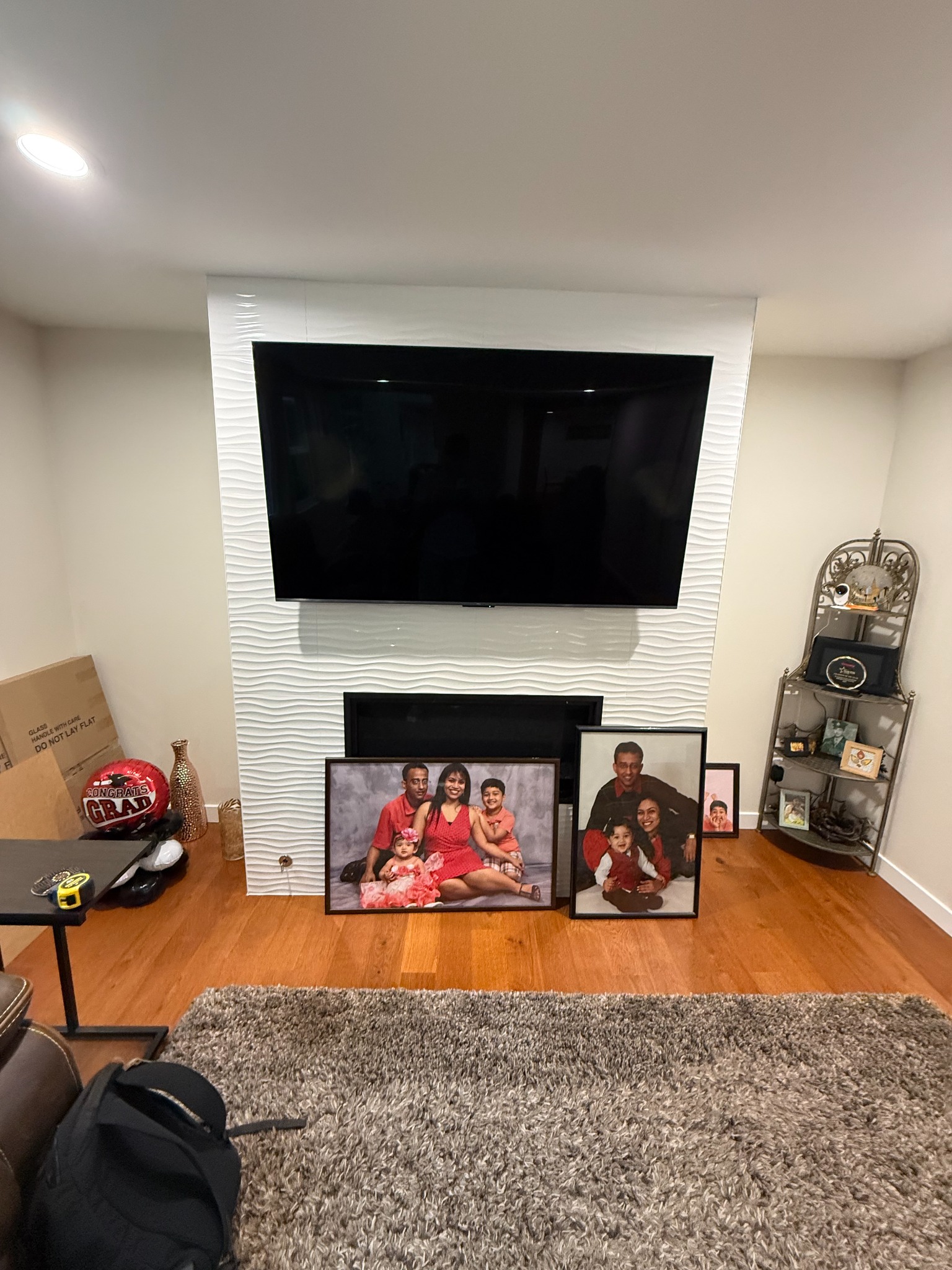 Before — the original fireplace and television wall