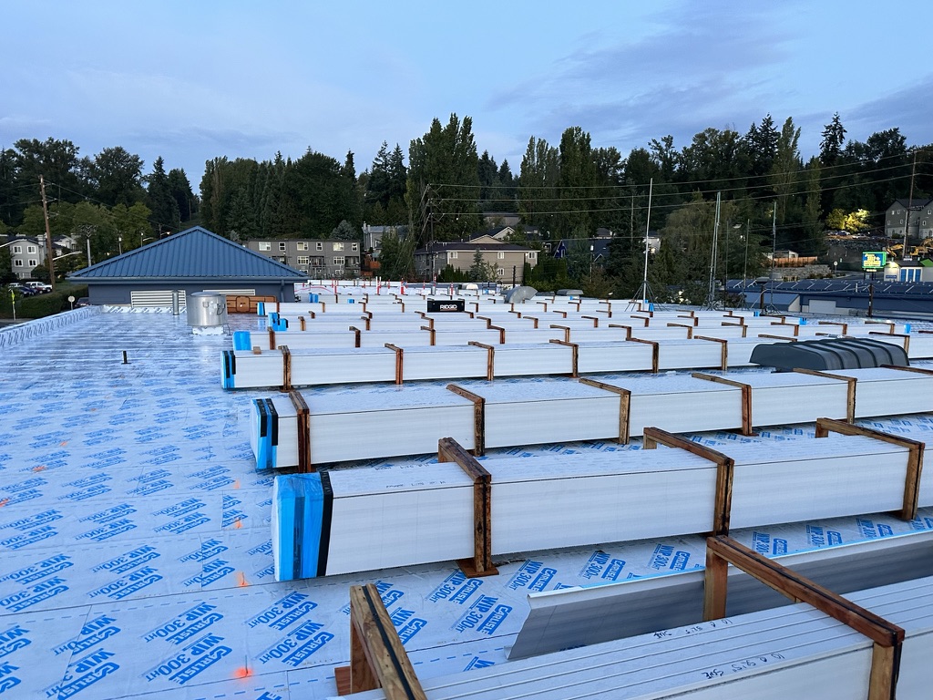 During construction — roof work and staged materials