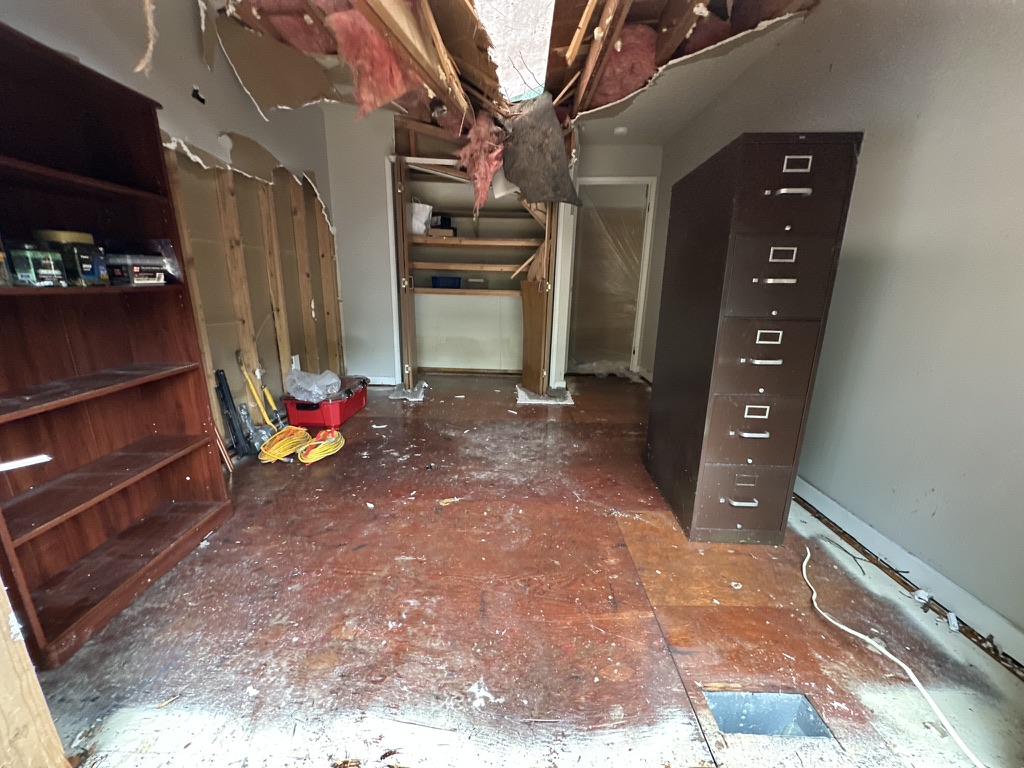 Before — ceiling and wall damage inside the home