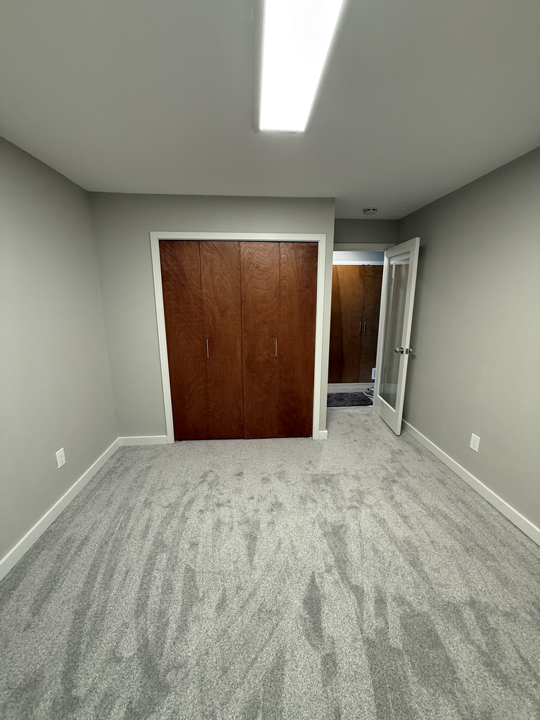 After — restored interior with repaired ceiling, walls, and flooring